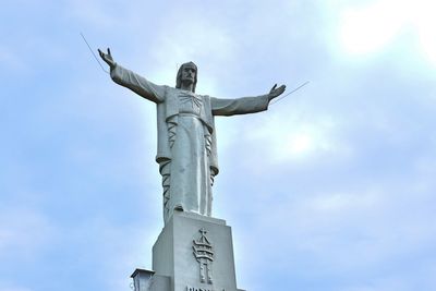 Low angle view of statue against sky