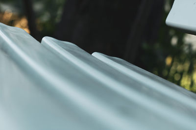 Close-up of white surface level of car