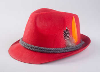 Close-up of red hat against white background