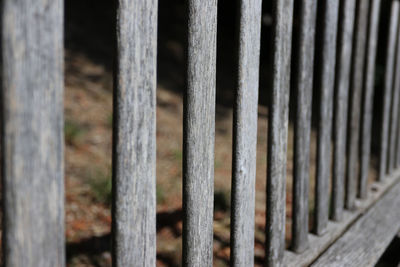 Close-up of metal fence by railing