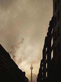 Low angle view of buildings against sky during sunset