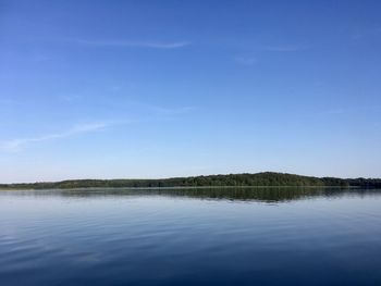 Scenic view of lake against blue sky