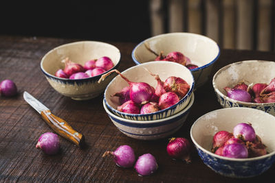 Fresh shallots-red onions on the dark background