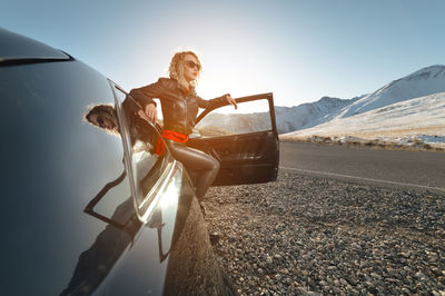 Low angle view of woman with umbrella