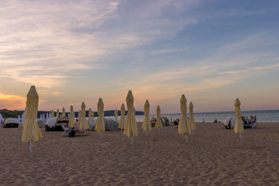 Scenic view of beach against sky during sunset