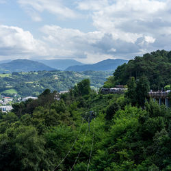 High angle view of trees and mountains against sky