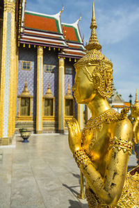 Statue of buddha outside building