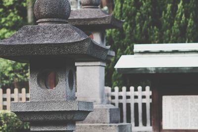 Close-up of cross in cemetery