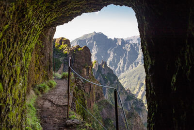 Scenic view of mountains seen through cave