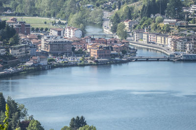 Bridge over river with buildings in background