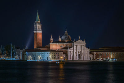 Illuminated buildings in city at night