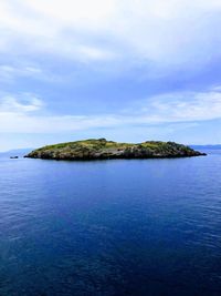 Scenic view of sea against sky island