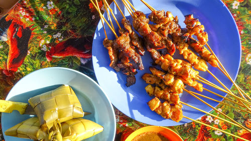 High angle view of meat on barbecue grill