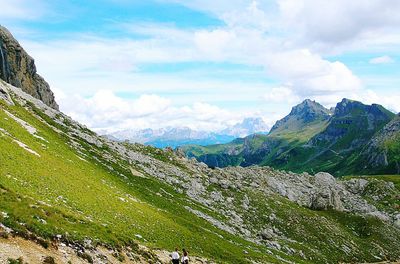Scenic view of mountains against cloudy sky
