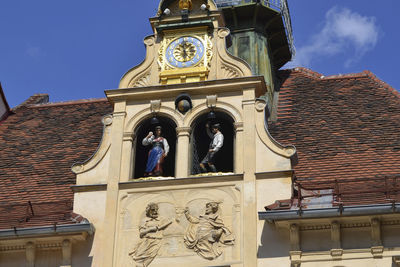 Low angle view of statue against building