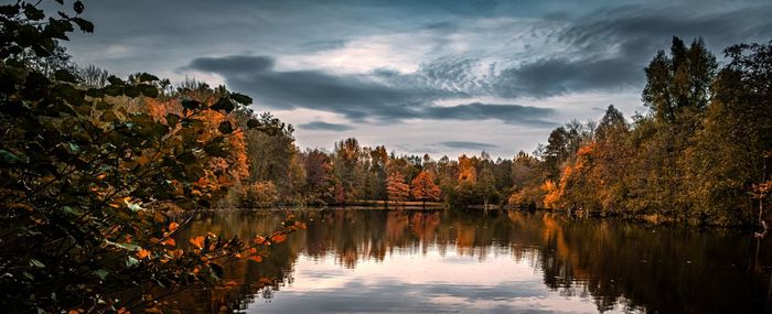 Scenic view of lake against sky during autumn