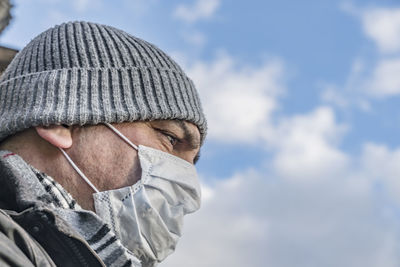 Portrait of man against sky during winter