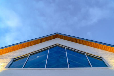 Low angle view of building against blue sky