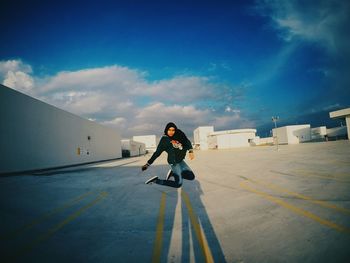 Full length of man skateboarding on mountain against sky