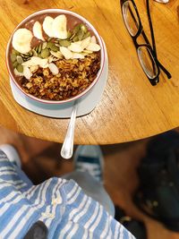 High angle view of person standing by food on table