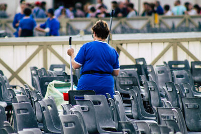 Rear view of man working on seat