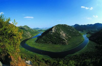 Scenic view of landscape against blue sky