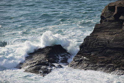 Sea waves splashing on rocks