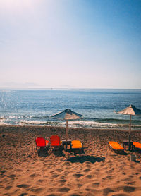 Scenic view of beach against clear sky