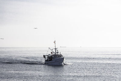 Boat sailing in sea