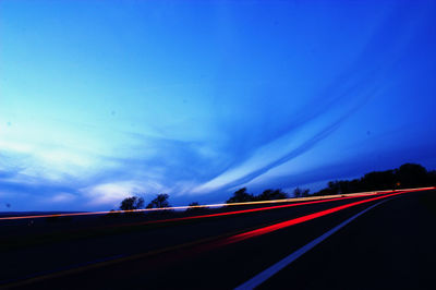 Traffic on road at dusk