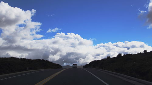 Empty road against sky