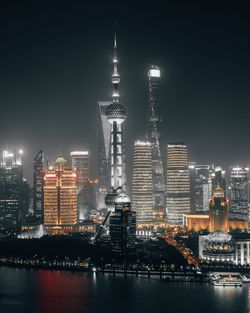 Illuminated buildings in city at night