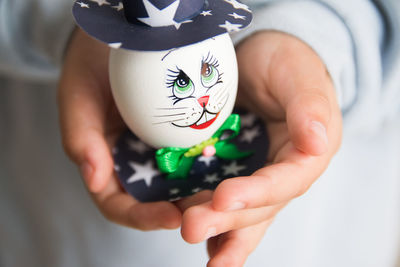 Child holding decorated easter egg