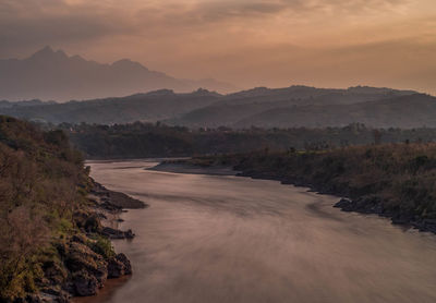 Scenic view of landscape against sky during sunset