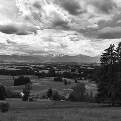 Scenic view of landscape against cloudy sky