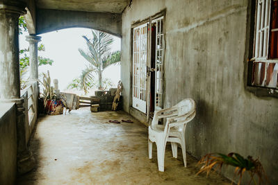 Empty chairs and tables in building