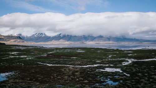 Scenic view of snowcapped mountains against sky