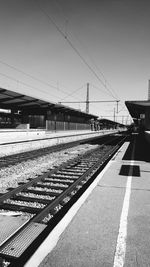 Railroad station against clear sky