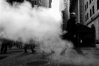 People walking on street in city