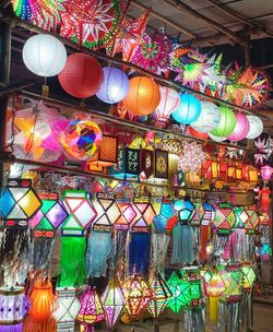 Low angle view of colorful lanterns hanging in row