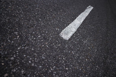 High angle view of arrow sign on road