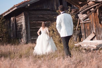 Bride and groom walking the fields