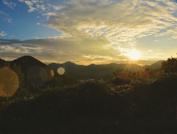 Scenic view of landscape against sky during sunset