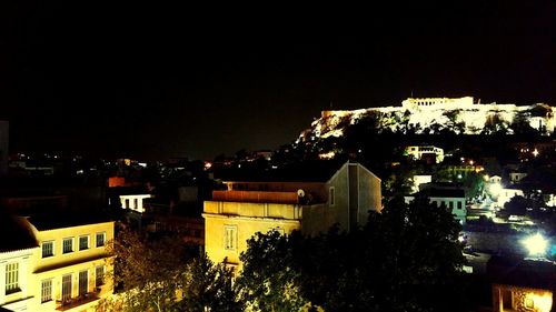 Buildings in city at night