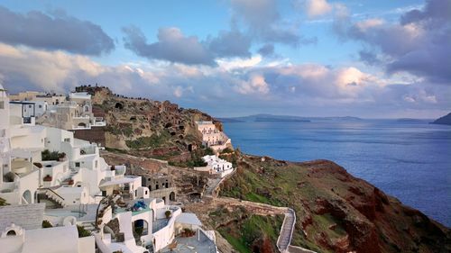 Panoramic shot of townscape by sea against sky