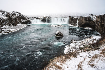 Scenic view of godafoss falls against sky