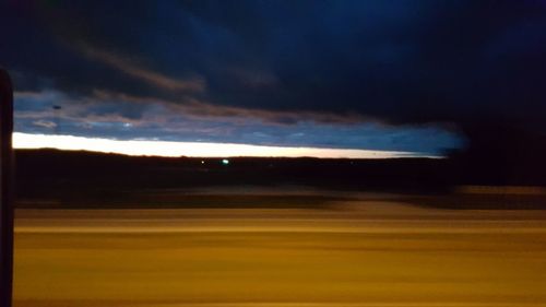 Scenic view of landscape against cloudy sky