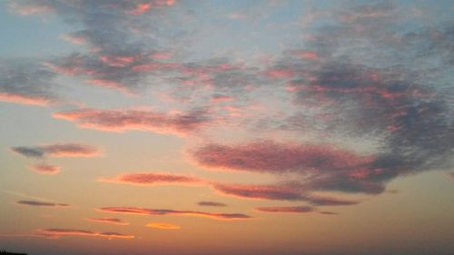 Low angle view of dramatic sky during sunset