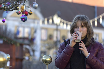 Portrait of woman drinking coffee