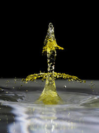 Blurred motion of water over black background